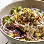 Esquites-style street corn chicken bowl with quinoa, charred corn salad, and diced avocado