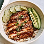 Crispy Chicken Katsu Bowls (Fast Weeknight Method) Crispy chicken katsu slices over rice with quick-pickled cucumbers, avocado, and tonkatsu sauce in a bowl
