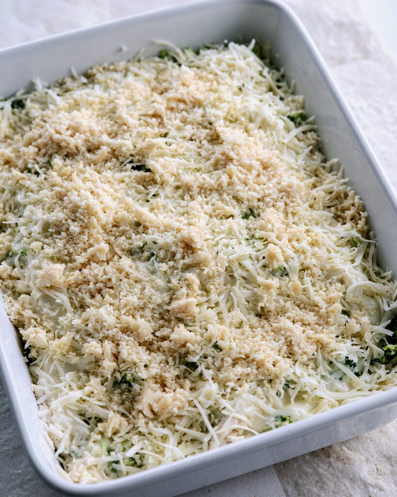 Shredded mozzarella and almond flour crumb topping spread over the casserole