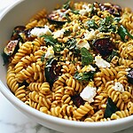 Finished blistered zucchini pasta salad with golden fusilli, caramelized squash, feta, and pine nuts