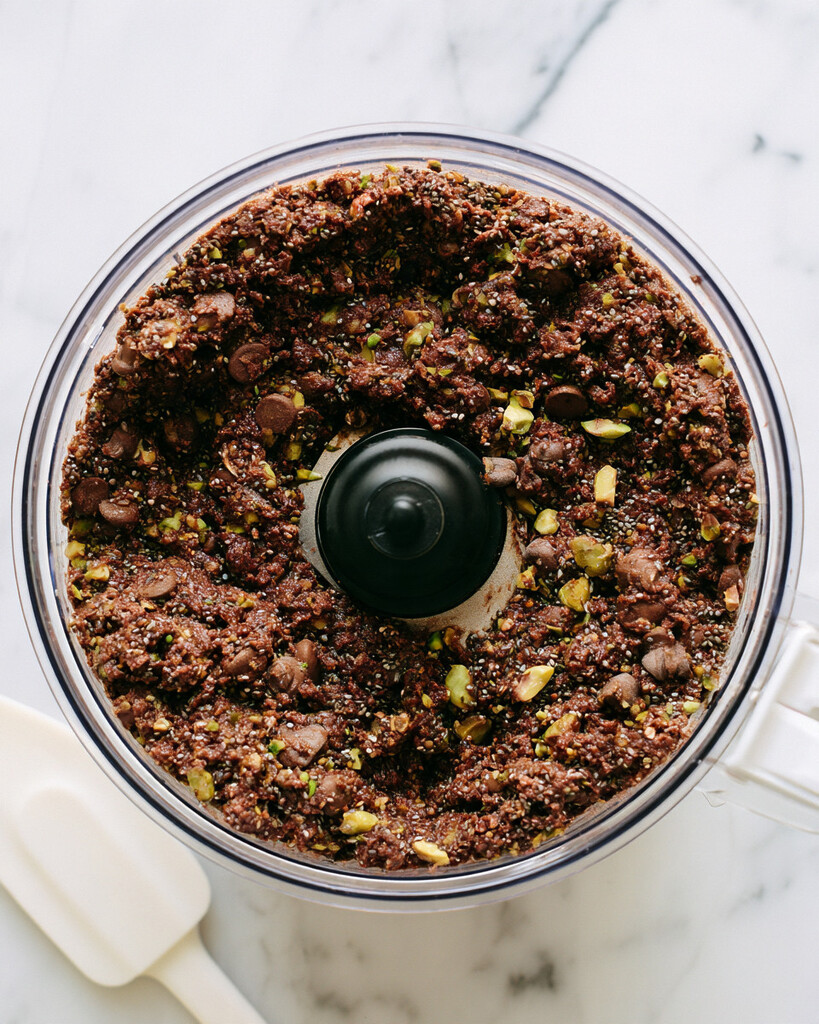 Chocolate chip, pistachio, and chia seed mix-ins folded into the dark dough inside a food processor